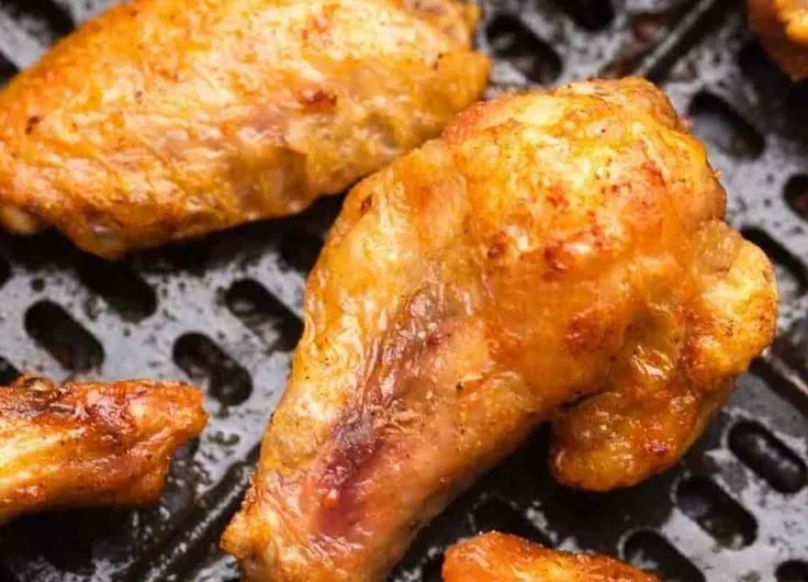Delicious air fryer frozen chicken wings served with dipping sauce