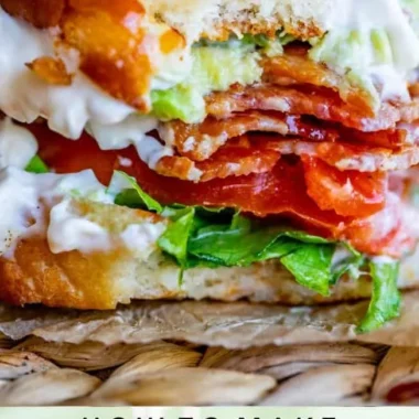 Avocado Bacon Lettuce and Tomato Sandwich served on a plate with fresh ingredients.
