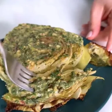 Delicious roasted cabbage steaks topped with flavorful herb butter