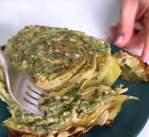 Delicious roasted cabbage steaks topped with flavorful herb butter