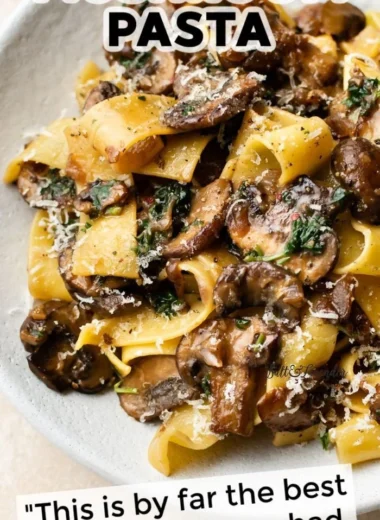 Easy garlic mushroom pasta dish garnished with parsley and parmesan cheese