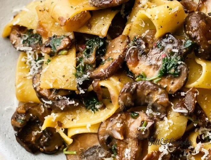 Easy garlic mushroom pasta dish garnished with parsley and parmesan cheese