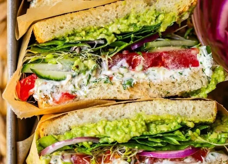 Laura's Amazing Fresh Veggie Sandwich with colorful vegetables and healthy ingredients