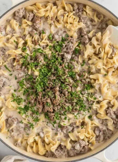 Delicious 30-Minute Ground Beef Stroganoff served with pasta and garnished with parsley