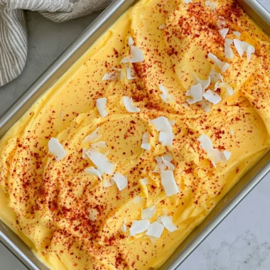 Chili Lime Mango Sorbet in a bowl garnished with lime and chili flakes