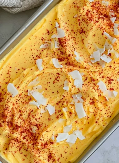 Chili Lime Mango Sorbet in a bowl garnished with lime and chili flakes