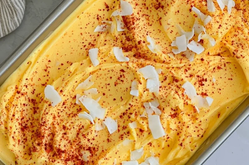Chili Lime Mango Sorbet in a bowl garnished with lime and chili flakes