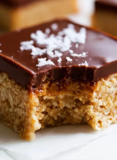 Delicious chocolate peanut butter oatmeal bars on a wooden table