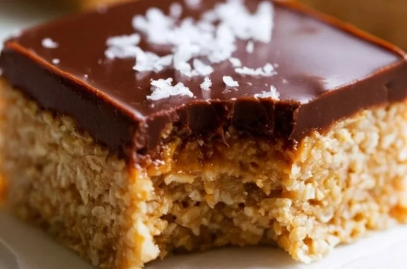 Delicious chocolate peanut butter oatmeal bars on a wooden table