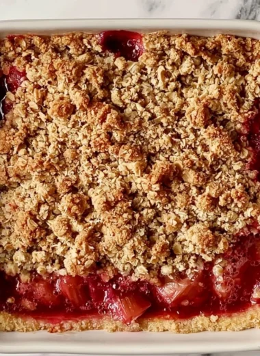 Classic rhubarb crumble bars topped with a golden crumble topping