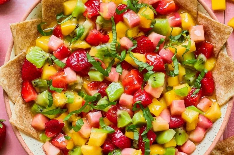 Bowl of fresh fruit salsa served with cinnamon sugar tortilla chips