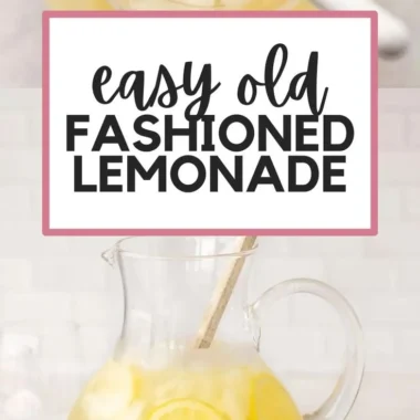 A refreshing glass of homemade lemonade with lemon slices and mint leaves.
