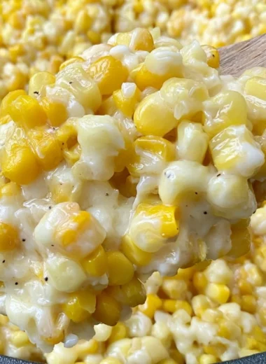 Honey butter corn skillet dish garnished with herbs