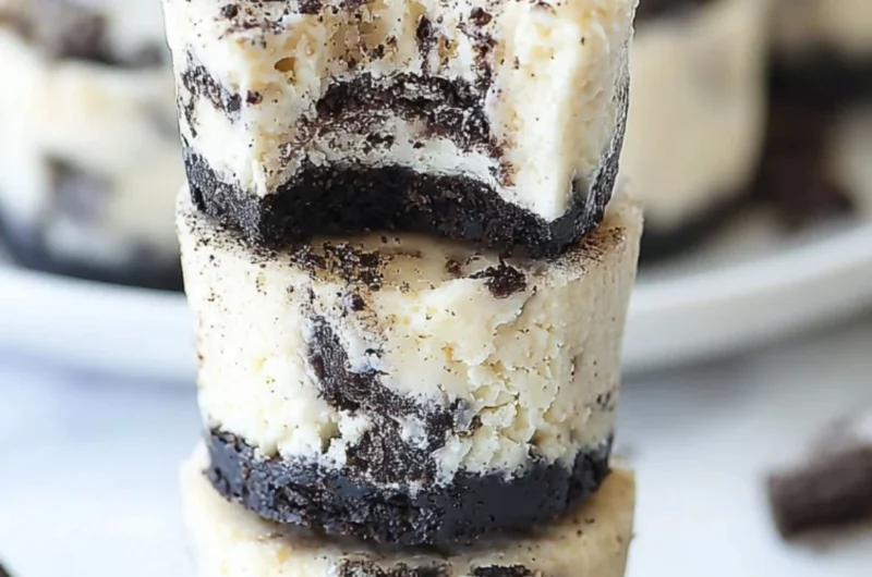 Delicious Mini Oreo Cheesecakes topped with crushed Oreos.