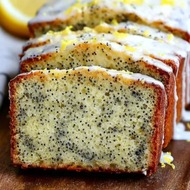Freshly baked moist lemon poppy seed bread with a golden crust and poppy seeds