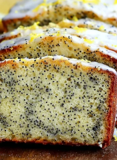 Freshly baked moist lemon poppy seed bread with a golden crust and poppy seeds
