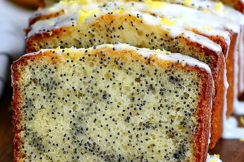 Freshly baked moist lemon poppy seed bread with a golden crust and poppy seeds