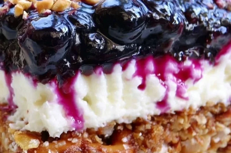 Delicious Blueberry Pretzel Salad served in a vibrant bowl, showcasing layers of flavors.