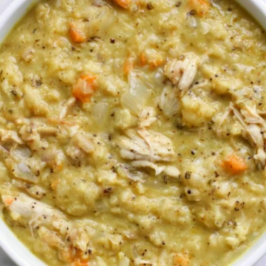 Bowl of creamy cauliflower chicken soup with herbs and spices