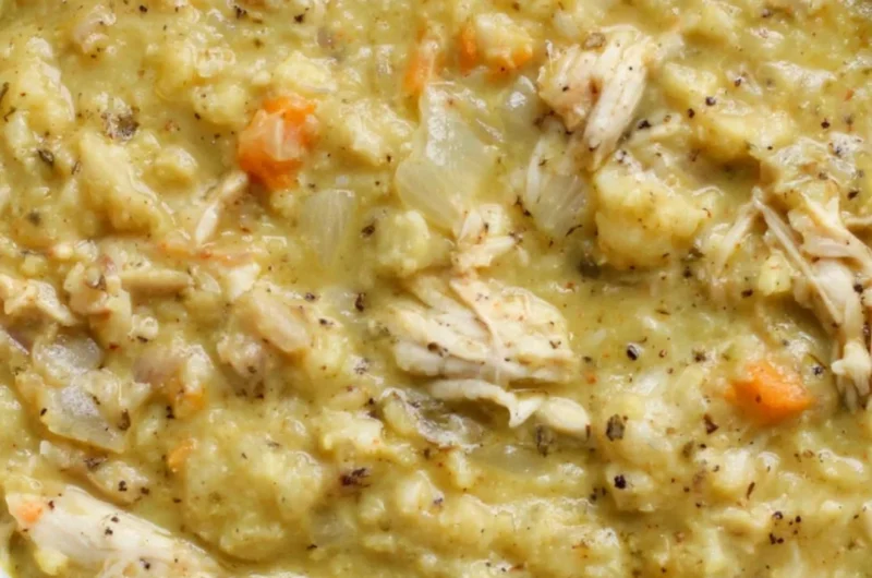 Bowl of creamy cauliflower chicken soup with herbs and spices
