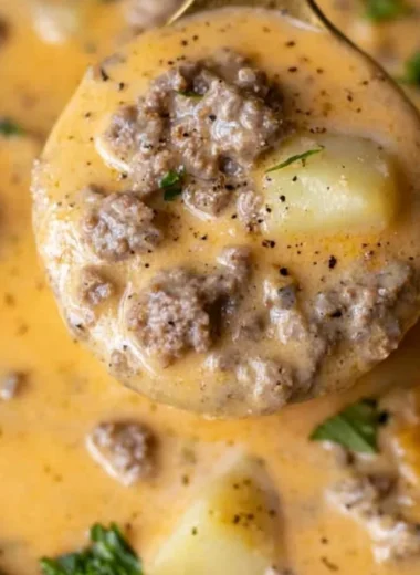 Bowl of Cheesy Beef and Potato Soup, a hearty and delicious meal.