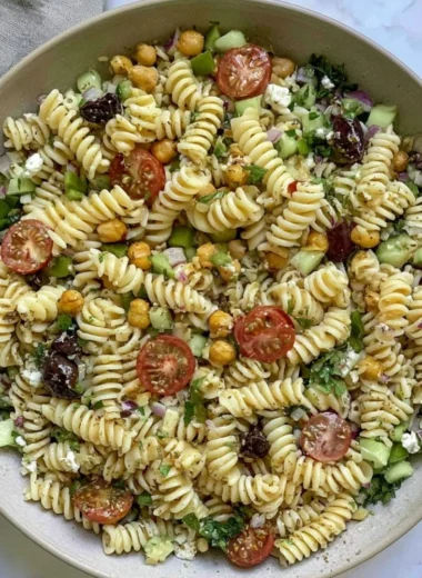 Cozy Vegan Greek Pasta Salad with fresh vegetables and herbs.