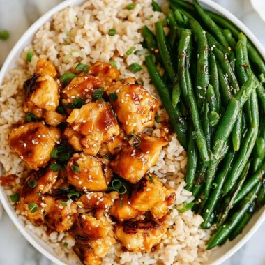 Delicious Honey Garlic Chicken served with green beans on a plate