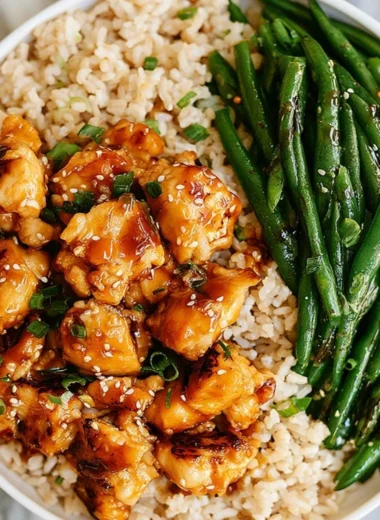 Delicious Honey Garlic Chicken served with green beans on a plate