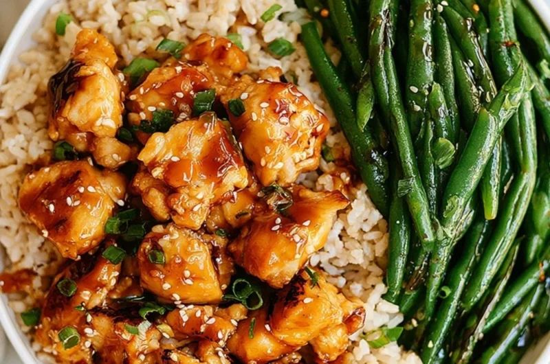 Delicious Honey Garlic Chicken served with green beans on a plate