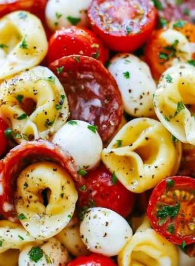 Roasted Red Pepper and Parmesan Tortellini Salad served in a bowl