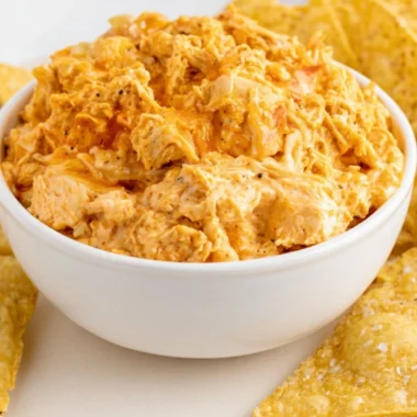 Delicious smoked buffalo chicken dip served in a bowl with chips