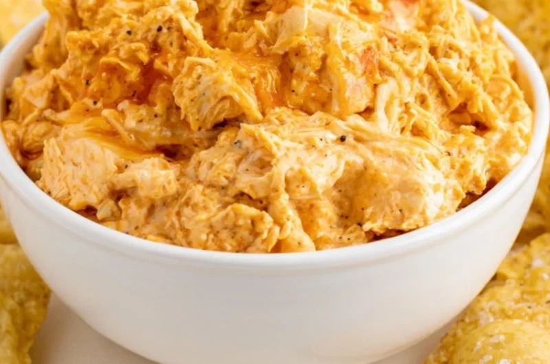 Delicious smoked buffalo chicken dip served in a bowl with chips