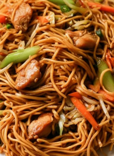 30-Minute Chicken Chow Mein served with colorful vegetables and noodles.