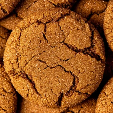 Cozy gingersnap cookies on a cooling rack, spiced and ready to enjoy.