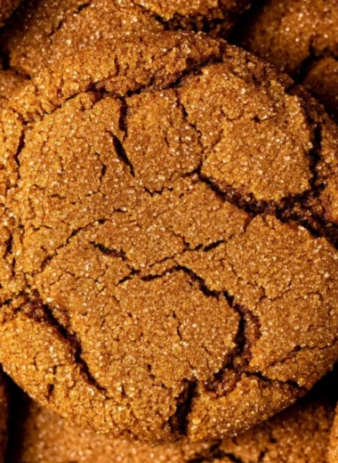 Cozy gingersnap cookies on a cooling rack, spiced and ready to enjoy.